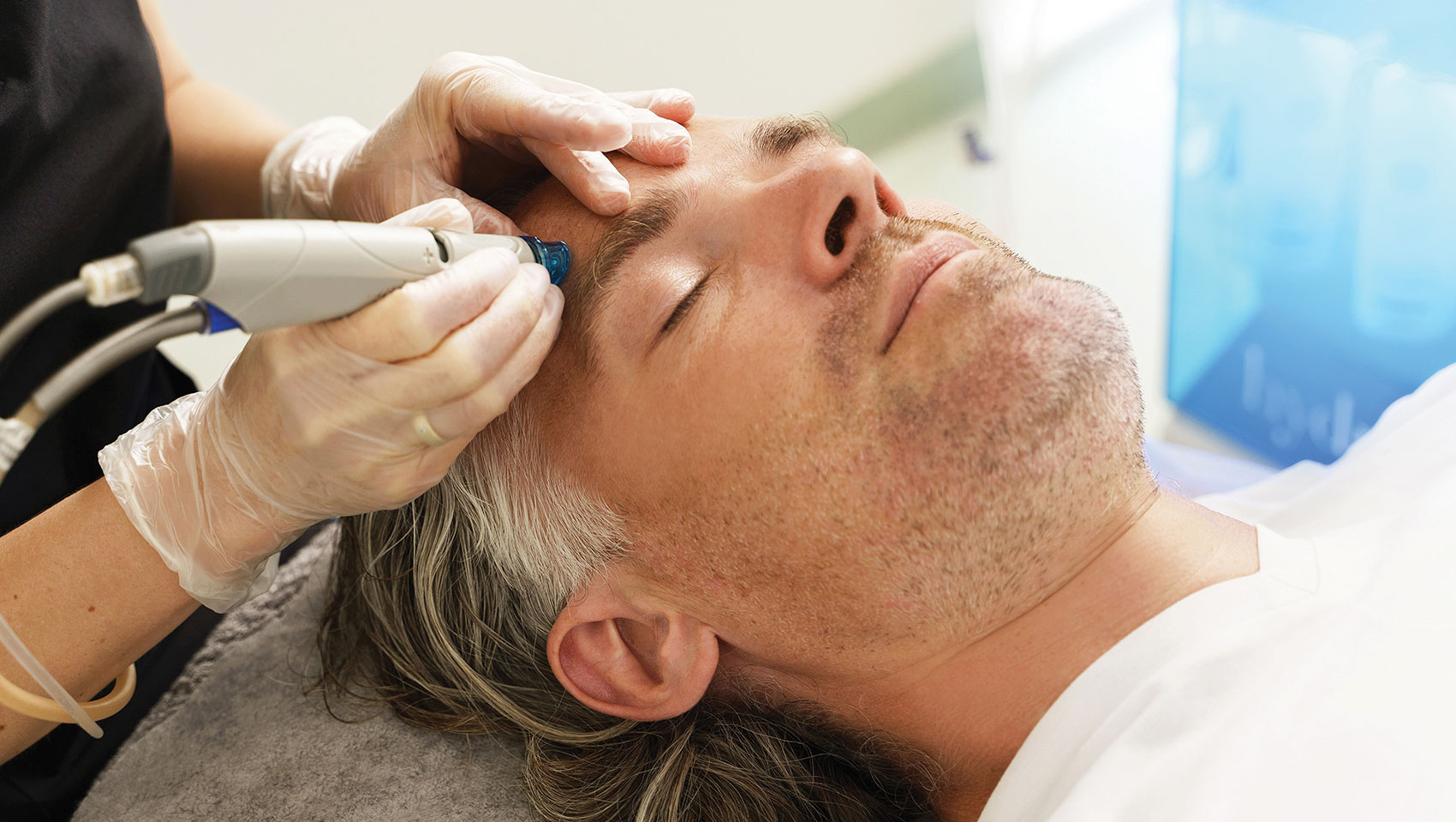 man laying down getting hydrafacial