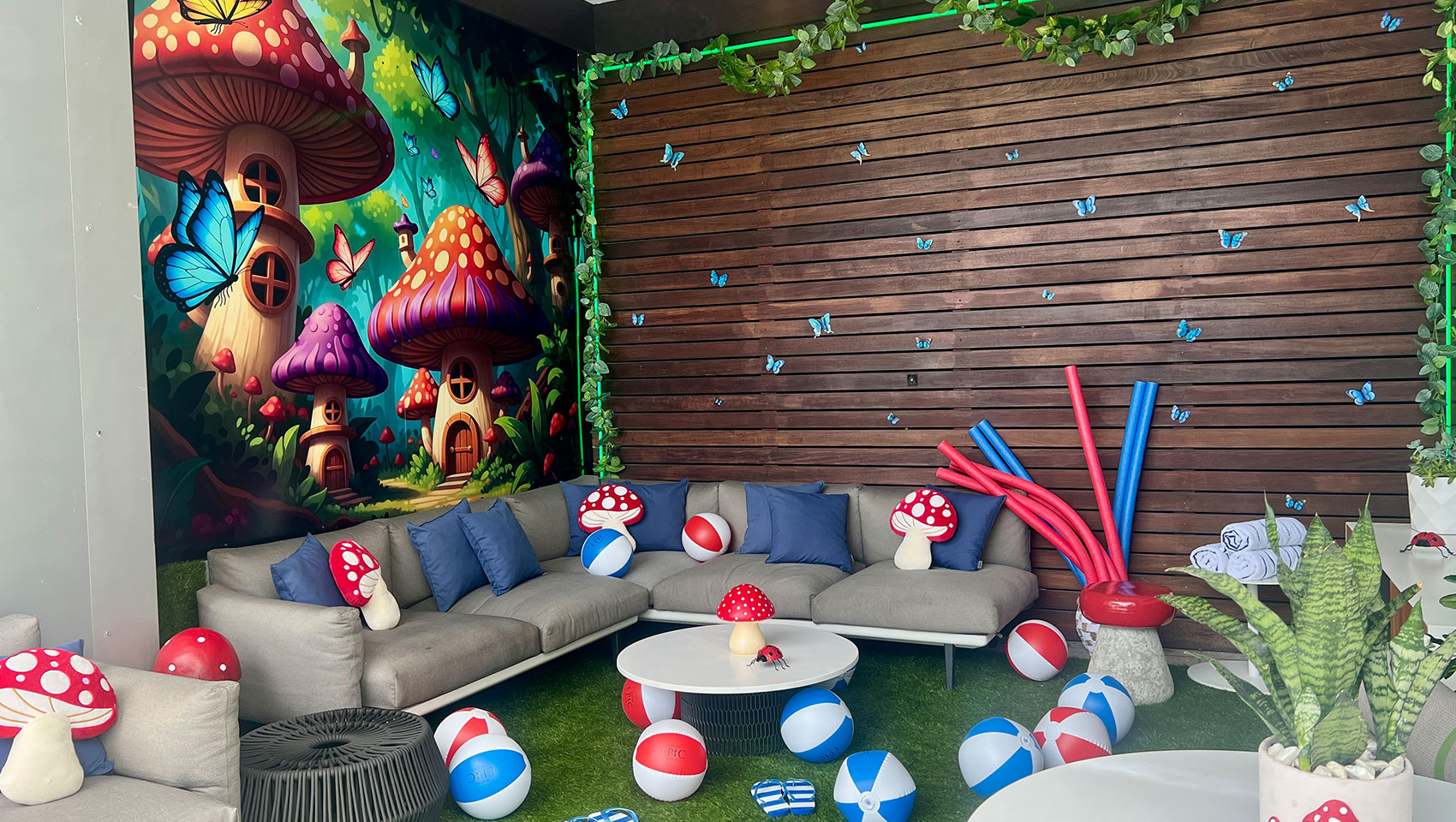 enchanted forest cabana with pool noodles, balls and mushroom décor