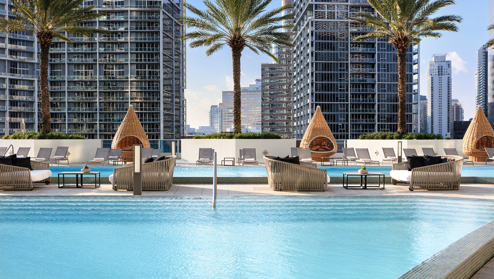 Woman on the rooftop pool deck in Miami, FL