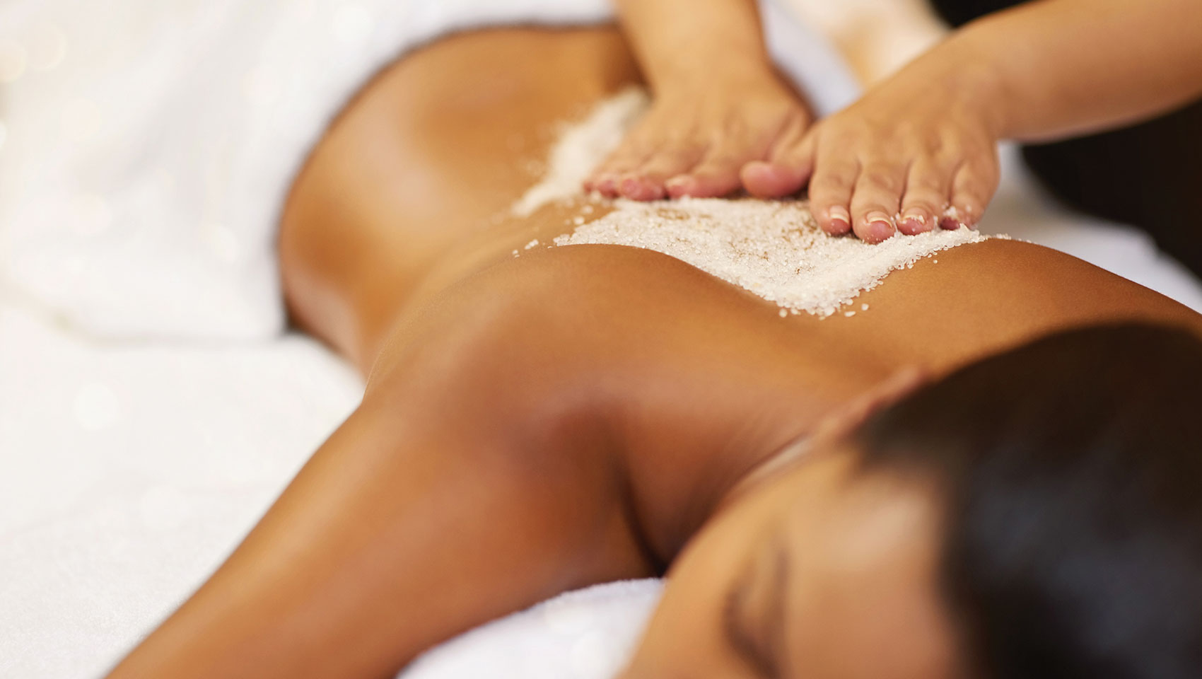 woman laying down getting massage